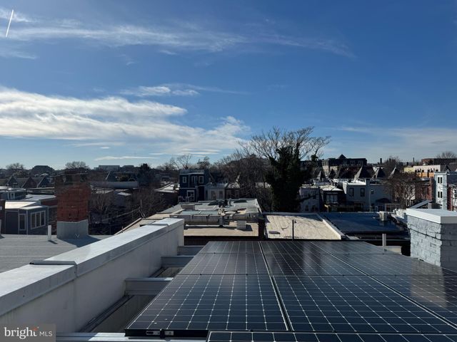 a view of a balcony with chairs
