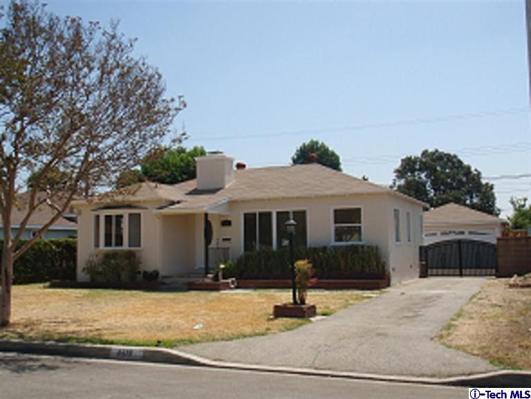 4518 Ranger Avenue El Monte, CA 91731 - Photo 1 of 20 a front view of a house with a yard and garage