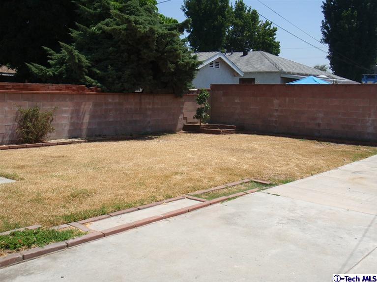 4518 Ranger Avenue El Monte, CA 91731 - Photo 14 of 20 a street view with wooden fence