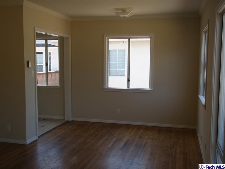 4518 Ranger Avenue El Monte, CA 91731 - Photo 3 of 20 an empty room with wooden floor and windows