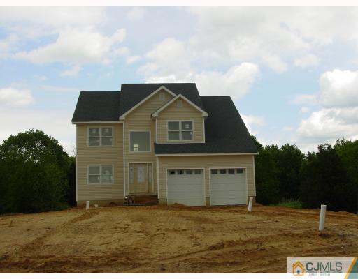 38 Burke Road Freehold, NJ 07728 - Photo 1 of 10 a front view of a house with a yard