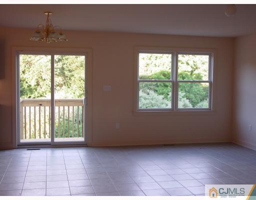 38 Burke Road Freehold, NJ 07728 - Photo 3 of 10 a view of an empty room with a window