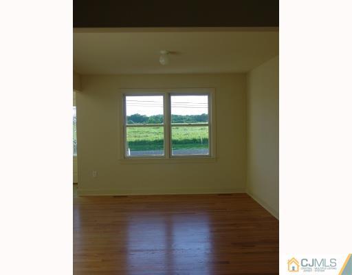 38 Burke Road Freehold, NJ 07728 - Photo 4 of 10 a view of a room that has a window in it