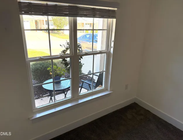 a spacious bathroom with a bathtub sink vanity mirror and toilet