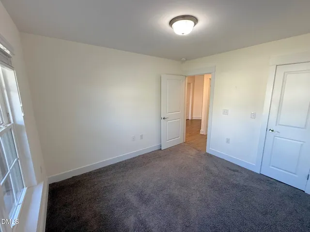 a view of a chairs and table in a balcony