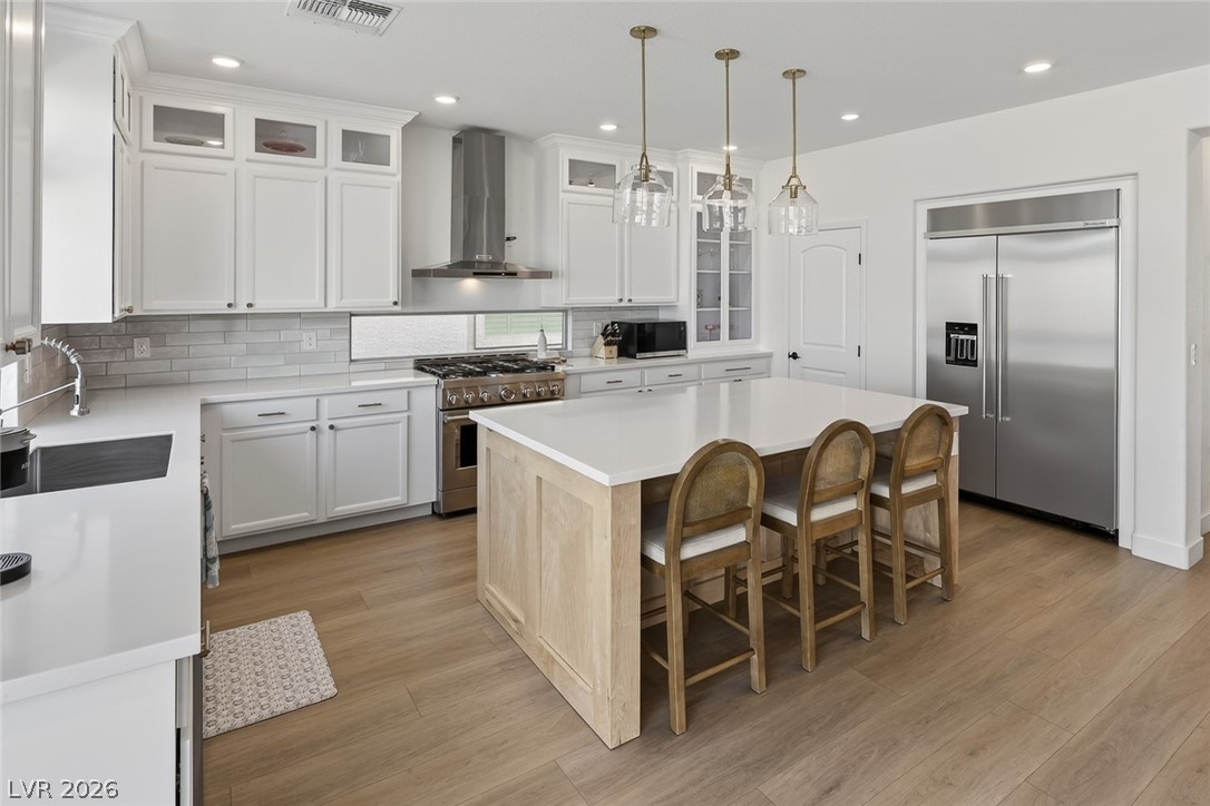 10446 Emerald Rye Street Las Vegas, NV 89183 - Photo 15 of 37 A well-appointed kitchen features a large island and ample cabinet space for effortless entertaining.