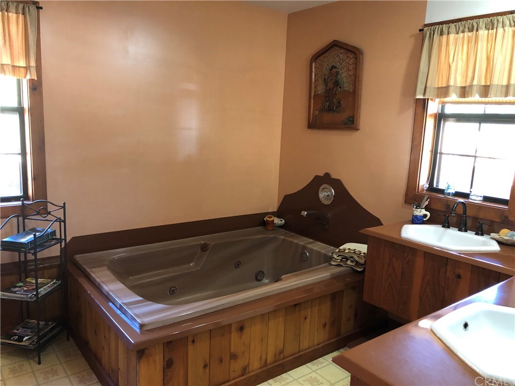 1865 Nacimiento Drive Paso Robles, CA 93446 - Photo 13 of 43 a bathroom with a bathtub and a window