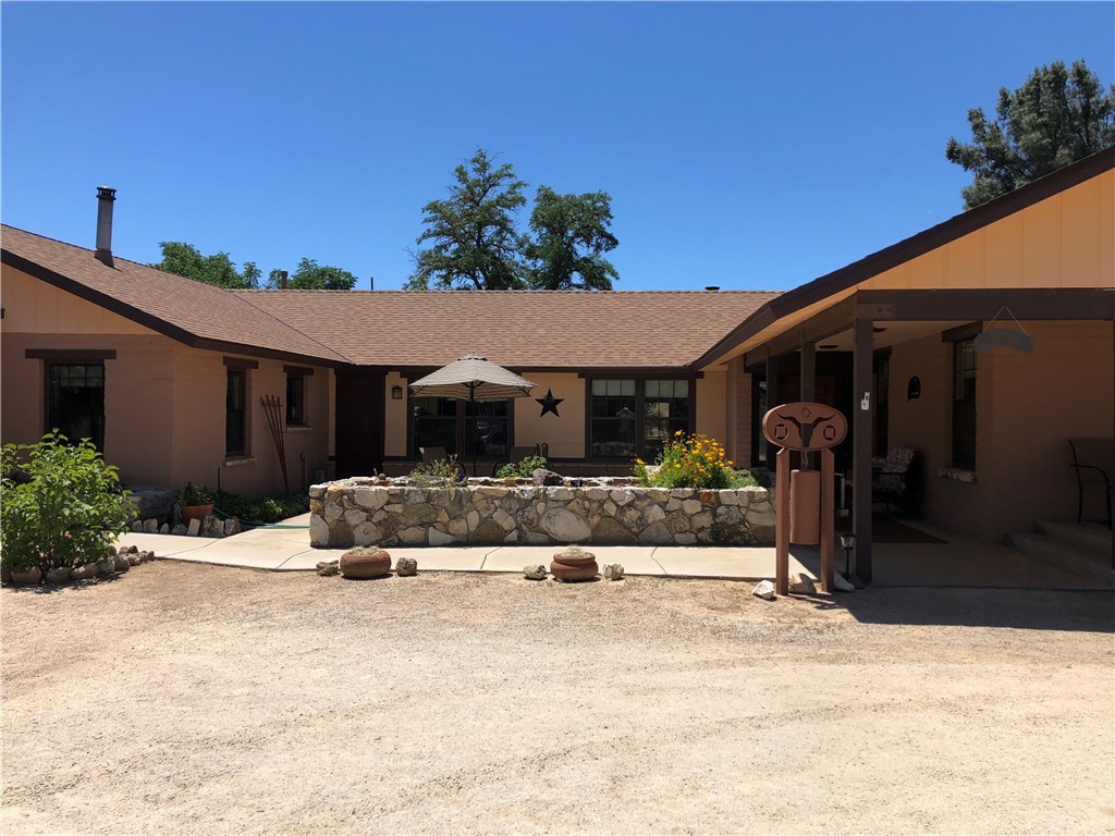 1865 Nacimiento Drive Paso Robles, CA 93446 - Photo 3 of 43 a view of a house with potted plants in front of it