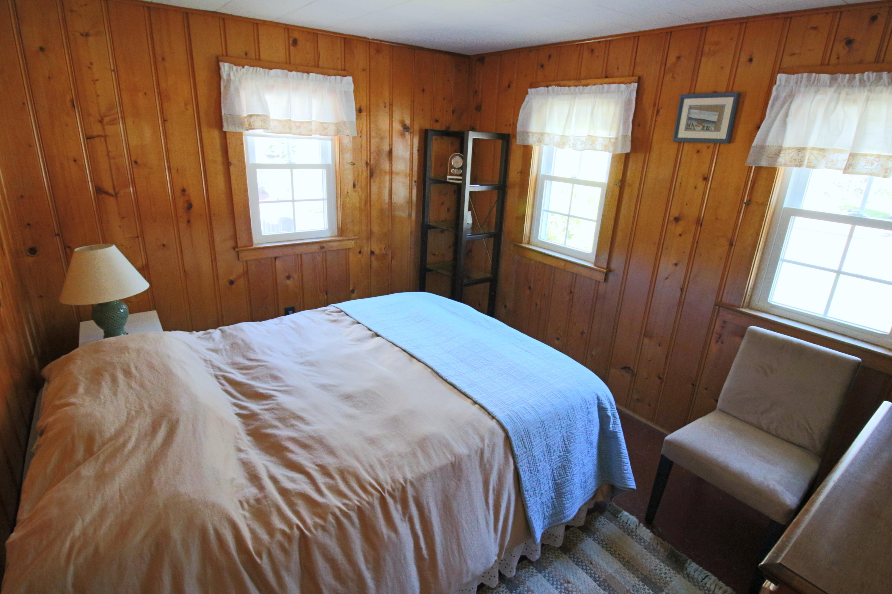 37 Beaten Road Dennis Port, MA 02639 - Photo 10 of 16 a bedroom with a bed and wooden floor