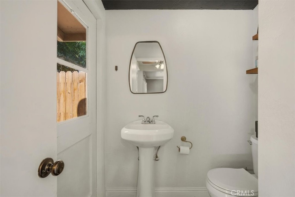 3495 Mono Drive Riverside, CA 92506 - Photo 16 of 36 a bathroom with a sink toilet and a mirror