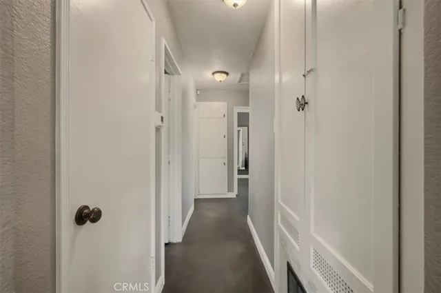 a view of a bathroom from a hallway