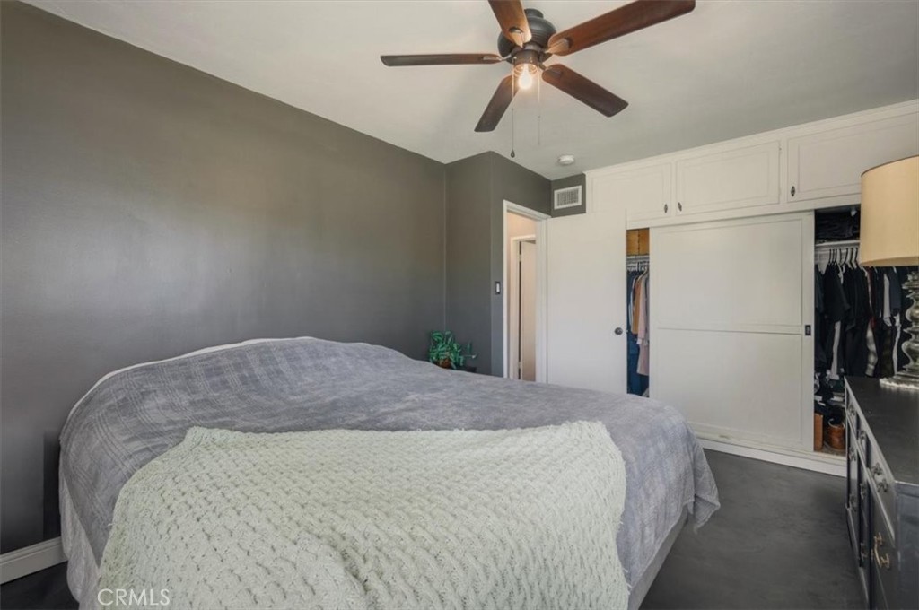 3495 Mono Drive Riverside, CA 92506 - Photo 22 of 34 a bedroom with a bed and a ceiling fan
