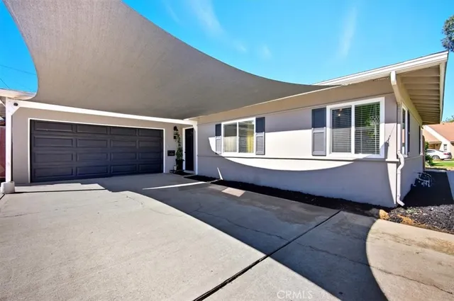 a front view of a house with a garage