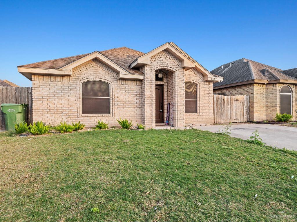 1012 Alpine Avenue Rio Grande City, TX 78582 - Photo 3 of 15 a front view of a house with a yard