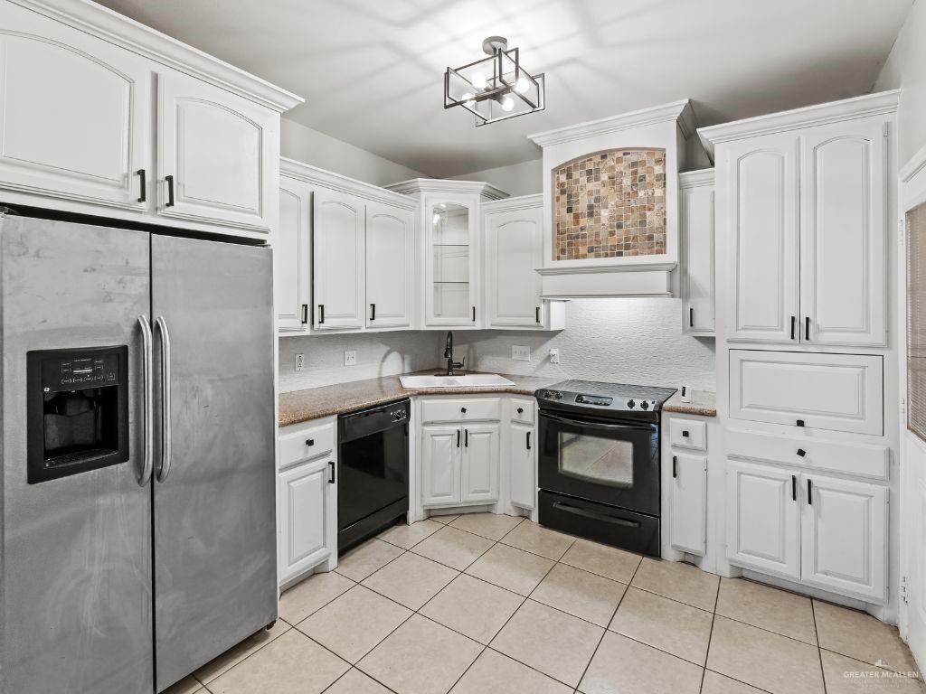 1012 Alpine Avenue Rio Grande City, TX 78582 - Photo 4 of 15 a kitchen with cabinets stainless steel appliances and a counter space