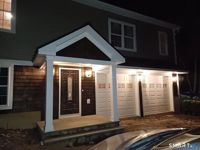 a view of backyard with large windows