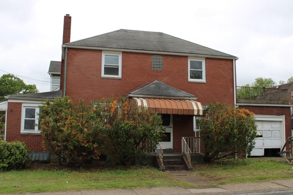 825 Liberty Street Duquesne, PA 15110 - Photo 3 of 25 a front view of a house with a yard