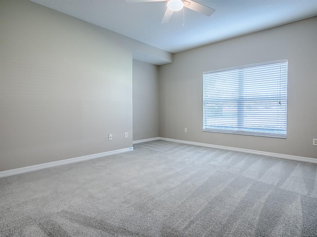 5318 Edgewater Way, Unit 10 Oxford, FL 34484 - Photo 12 of 18 an empty room with a window