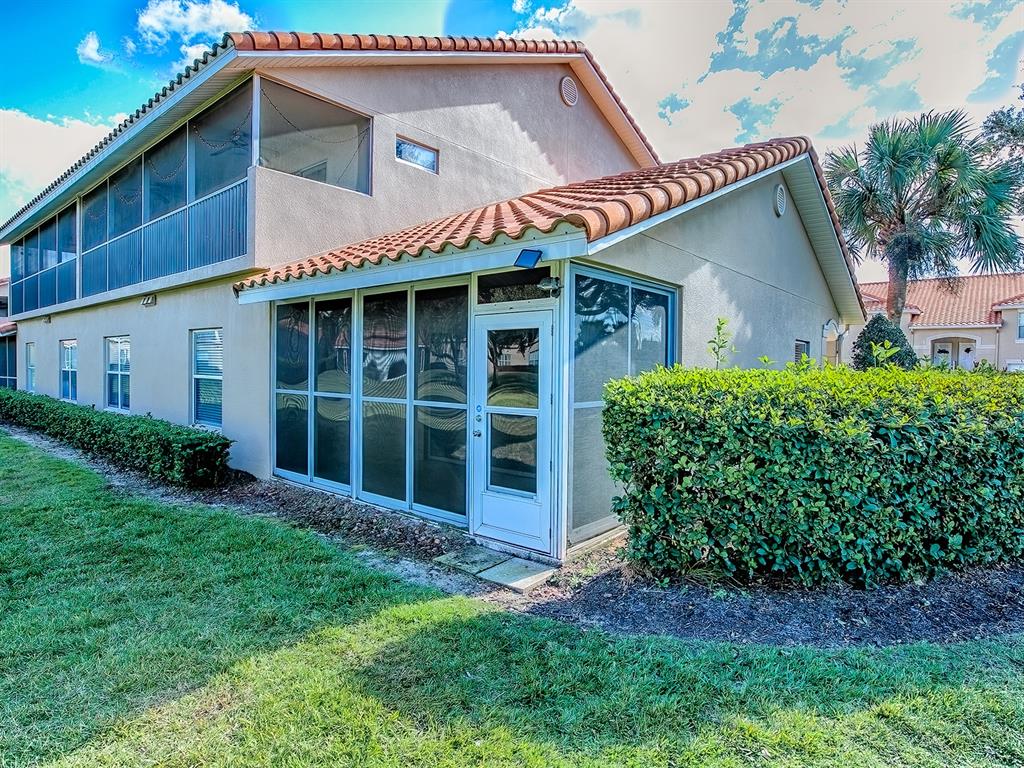 5318 Edgewater Way, Unit 10 Oxford, FL 34484 - Photo 16 of 18 a view of a house with a yard and plants