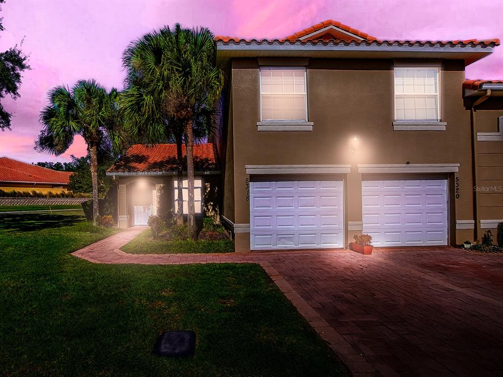 5318 Edgewater Way, Unit 10 Oxford, FL 34484 - Photo 18 of 18 a front view of a house with a yard