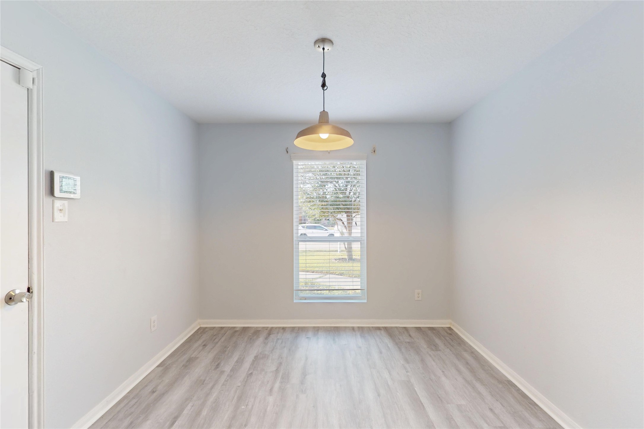 9877 Lace Flower Way Conroe, TX 77385 - Photo 14 of 43 a room that has a window in it with a chandelier