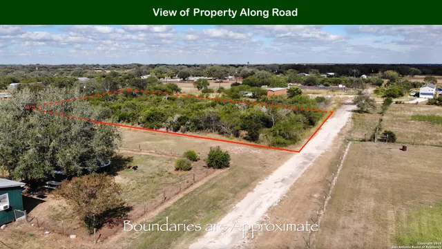 an aerial view of a yard with horses