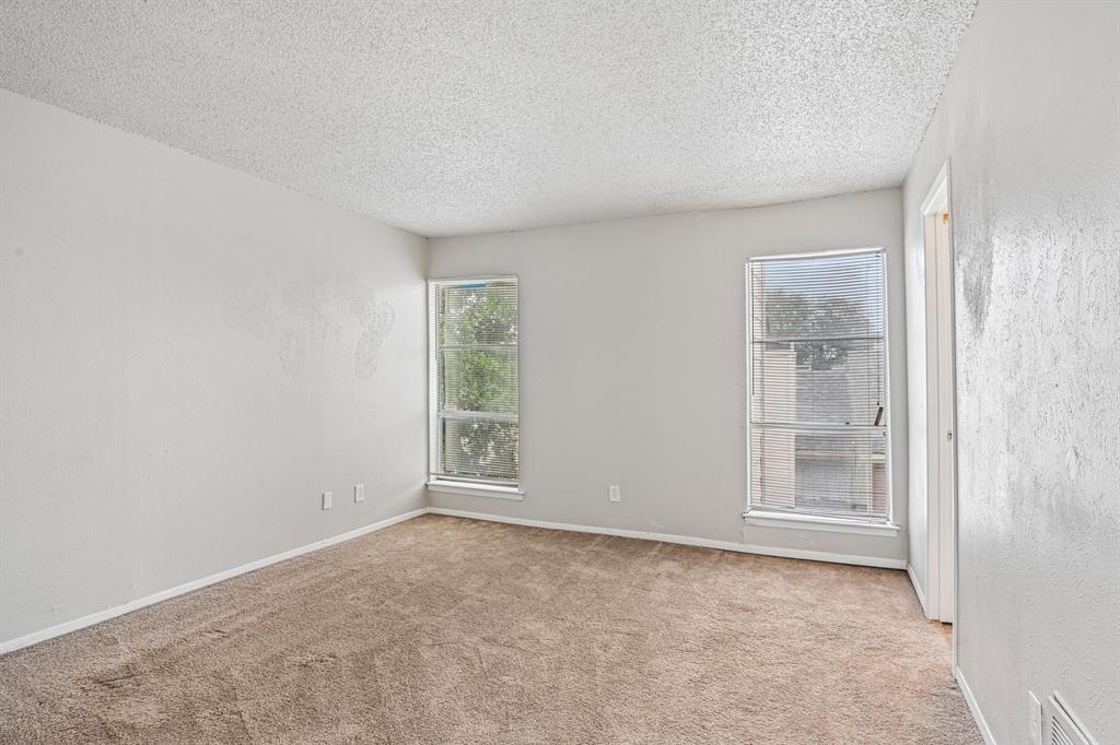 5534 Boca Raton Boulevard, Unit 292 Fort Worth, TX 76112 - Photo 19 of 31 an empty room with windows