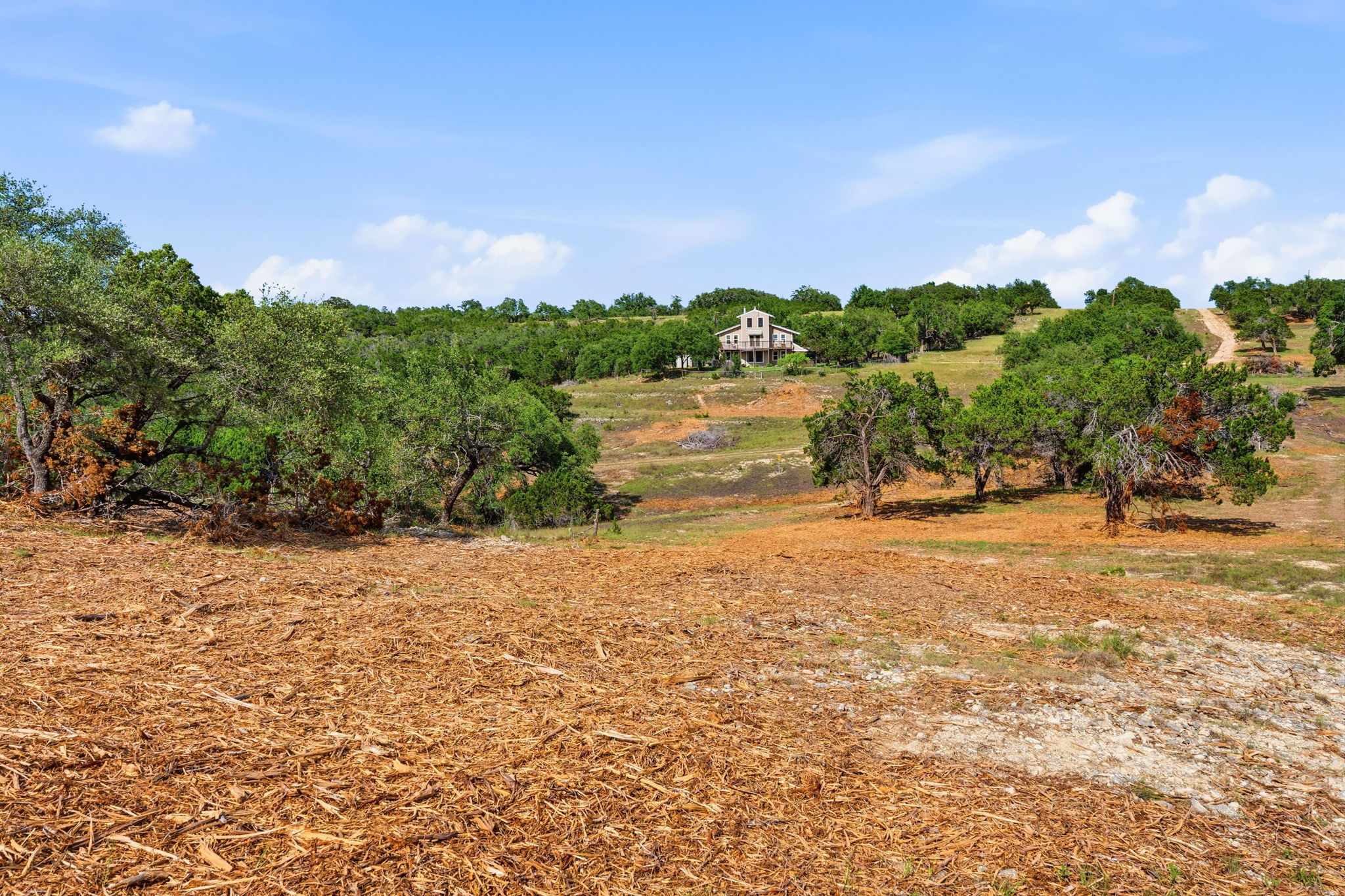 3230 West Fitzhugh Road Dripping Springs, TX 78620 - Photo 26 of 34 Perched atop a verdant hill, this secluded residence offers panoramic views and tranquil country living.