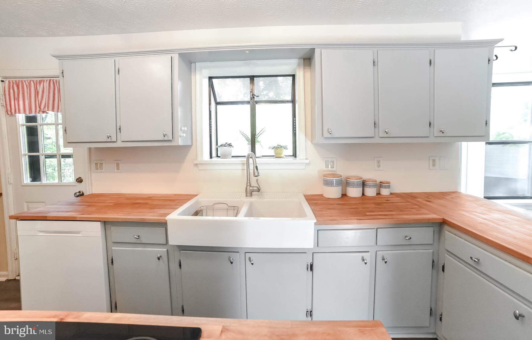 44575 Spinnaker Way California, MD 20619 - Photo 12 of 52 Painted cabinetry with new farmhouse sink