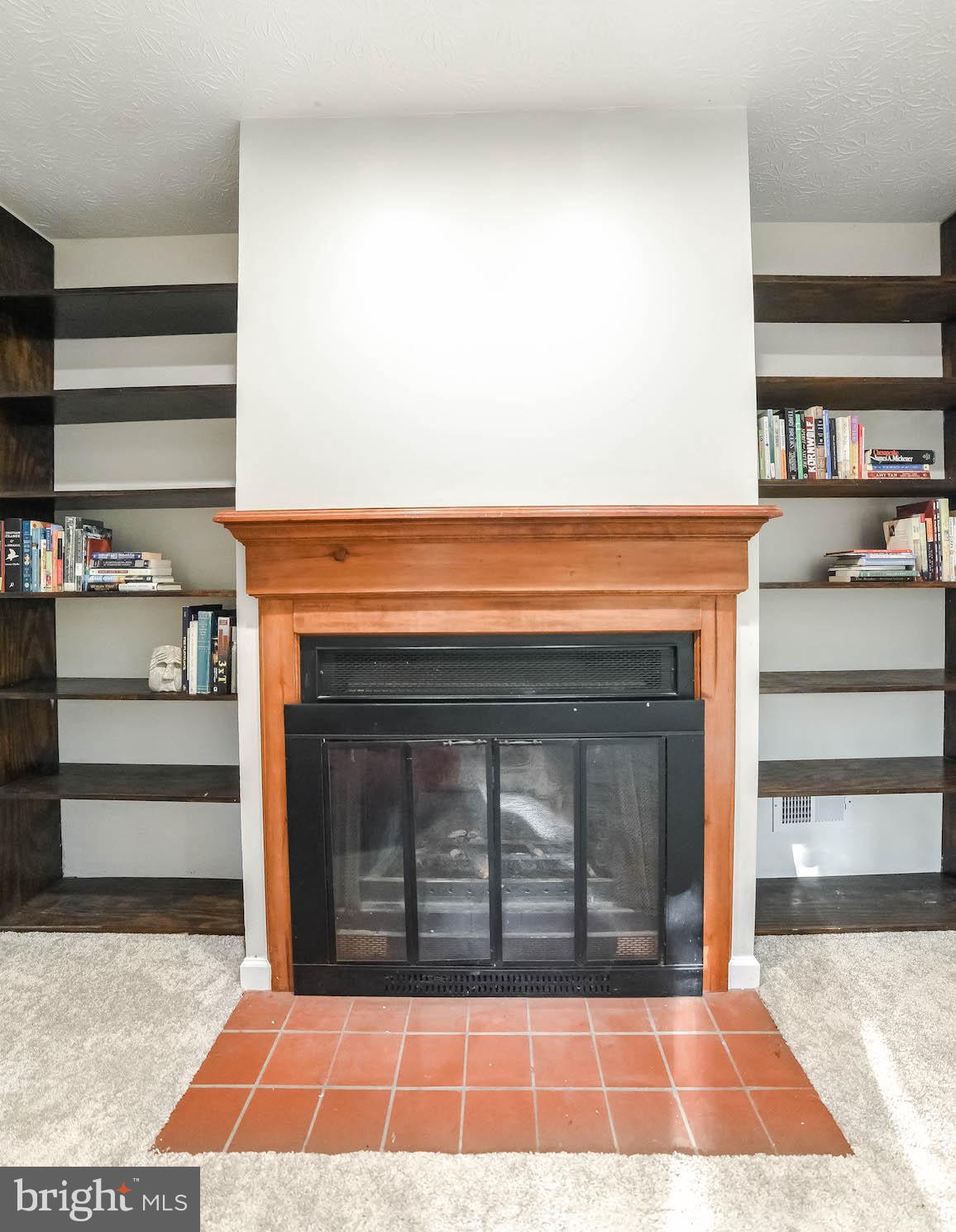 44575 Spinnaker Way California, MD 20619 - Photo 21 of 52 Wood-burning fireplace for cozy winter nights