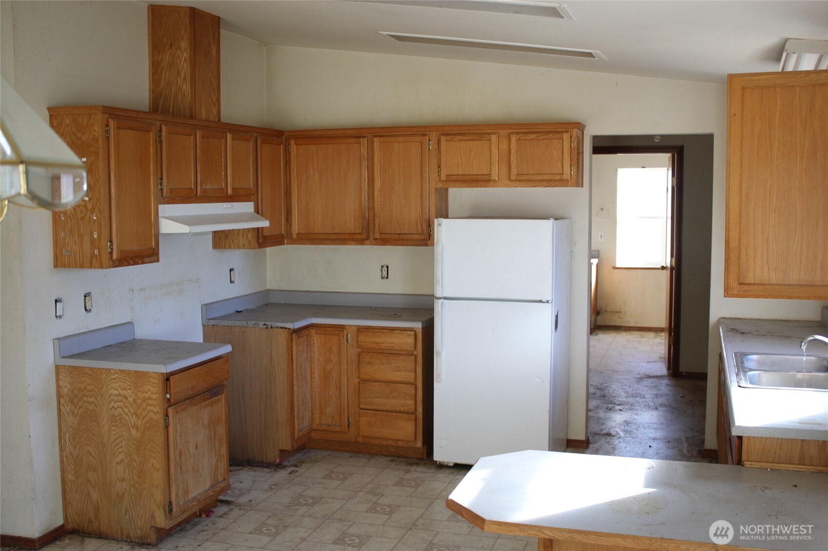 1251 North Klein Road Ritzville, WA 99169 - Photo 11 of 21 a kitchen with stainless steel appliances granite countertop a refrigerator a sink and a stove