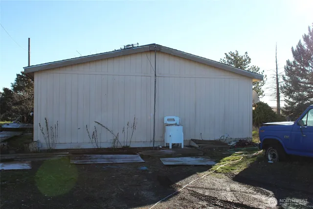 a kitchen with stainless steel appliances granite countertop a refrigerator a sink and a stove