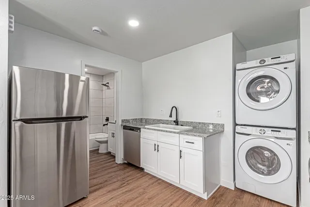 a kitchen with a washer and dryer