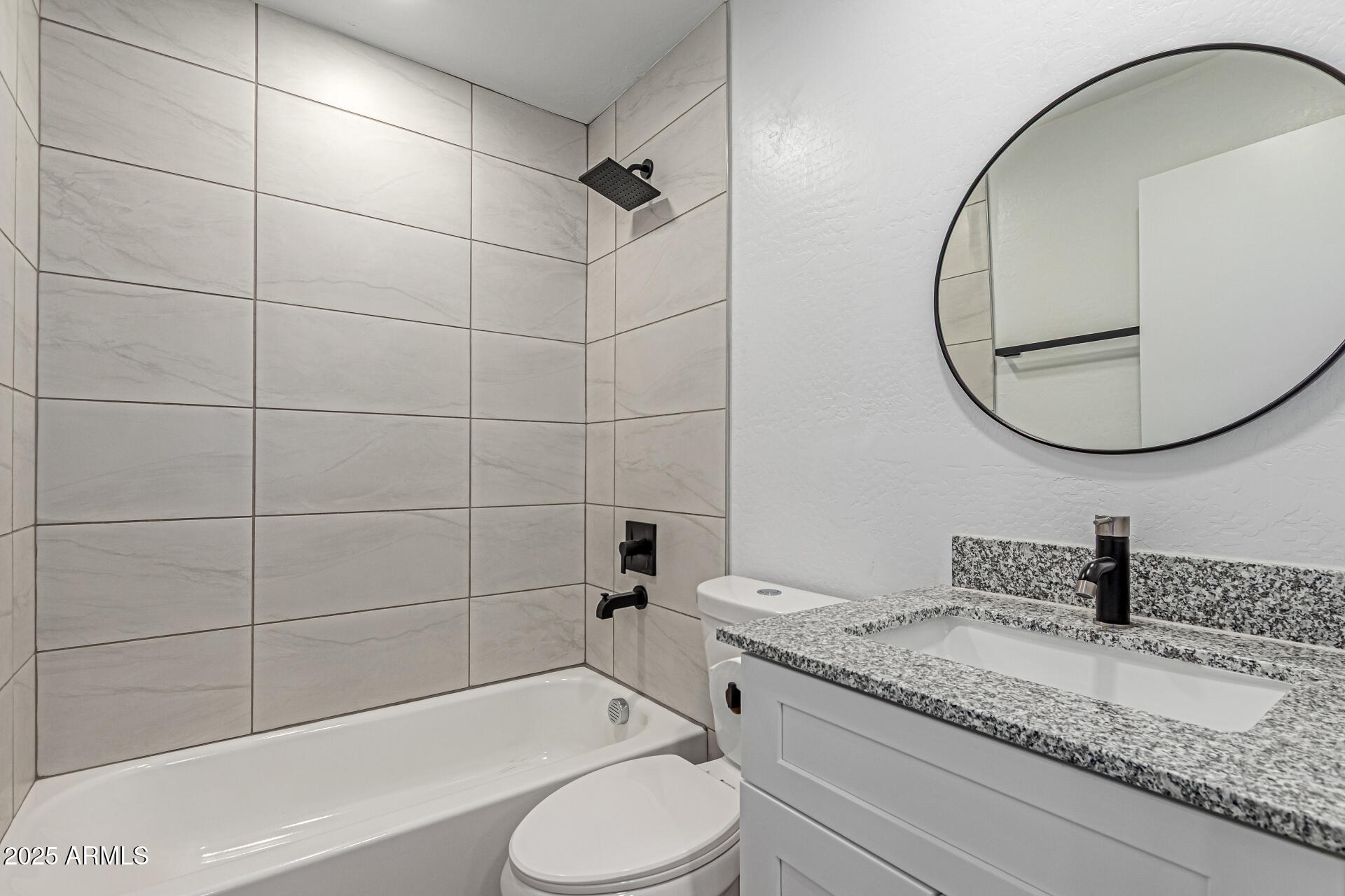 341 South Mountain Road, Unit 4 Apache Junction, AZ 85120 - Photo 10 of 18 a bathroom with a granite countertop sink toilet and shower