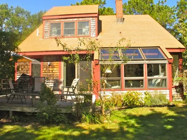 a view of house with yard