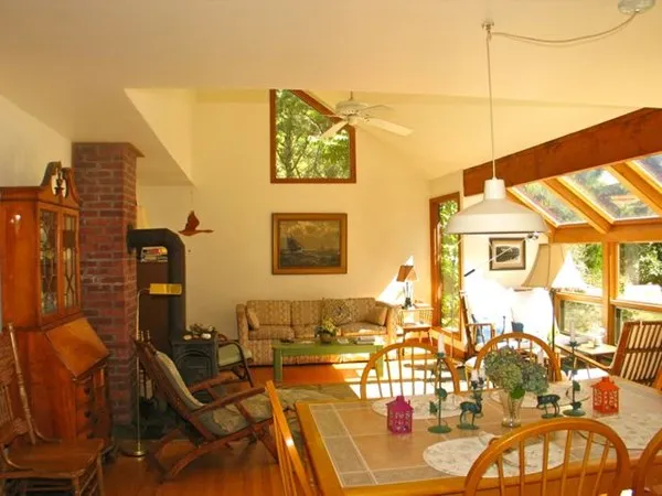 a front view of a house with outdoor seating