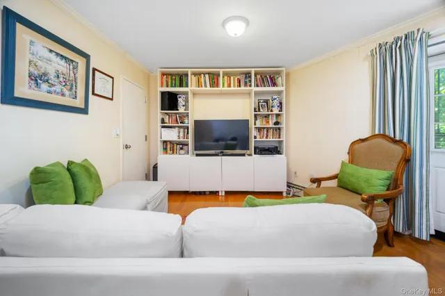 a living room with a couch and a flat screen tv