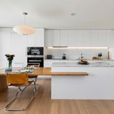 a kitchen with stainless steel appliances granite countertop a sink a stove and a refrigerator