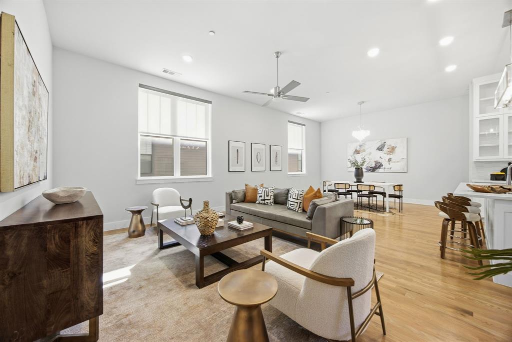 625 North Tyler Street, Unit 402 Dallas, TX 75208 - Photo 12 of 31 a living room with furniture a chandelier and a table