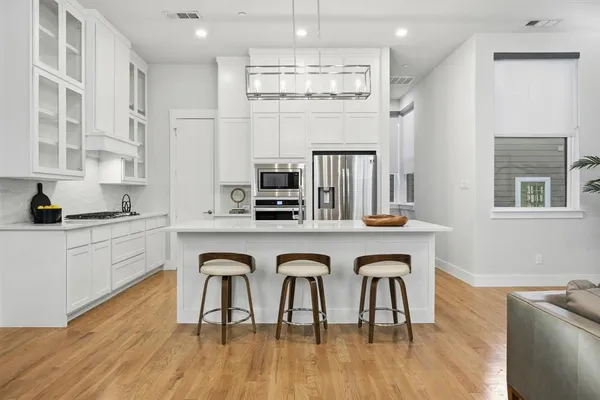 a view of a dining room with furniture and wooden floor
