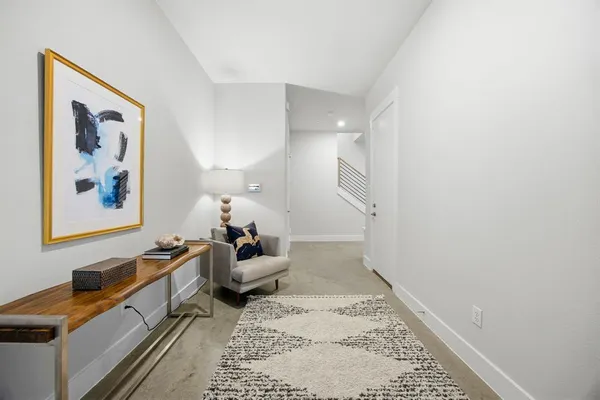 a view of entryway with wooden floor and stairs