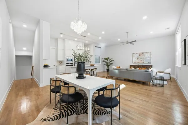 a view of a dining room with furniture and wooden floor