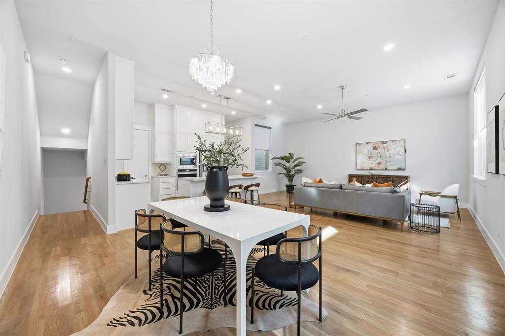 625 North Tyler Street, Unit 402 Dallas, TX 75208 - Photo 7 of 31 a view of a dining room with furniture and wooden floor