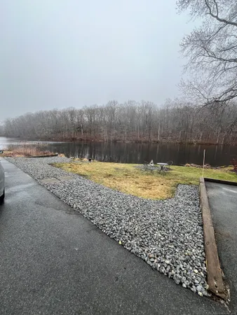 a view of a swimming pool with a yard