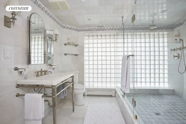 a bedroom with a bed dresser and a window