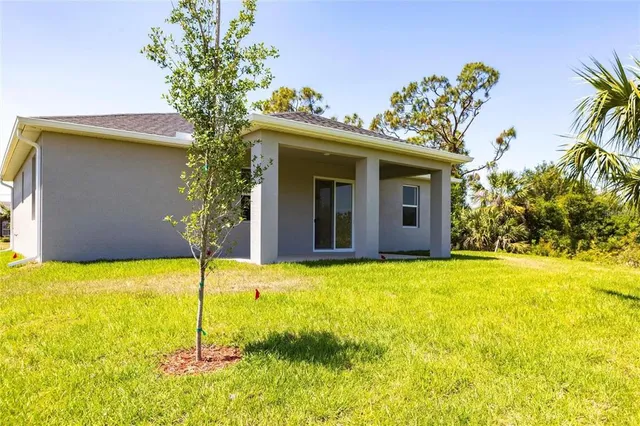 a view of a backyard with potted plants
