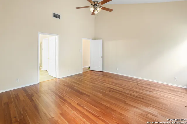 a bathroom with a sink a toilet a mirror and shower