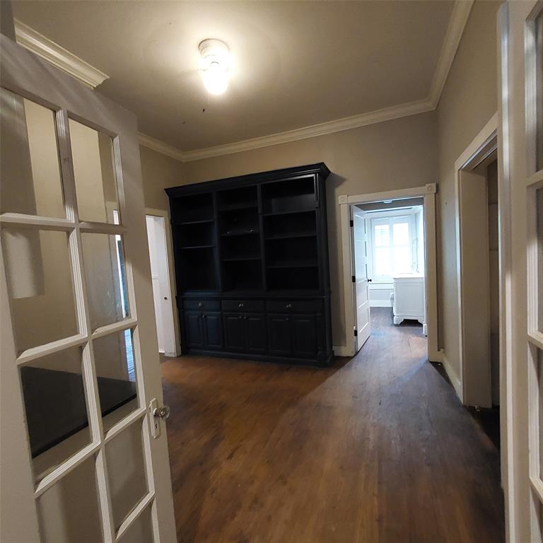 601 Holbrook Street Mount Vernon, TX 75457 - Photo 16 of 35 a view of an empty room with a fireplace and a window