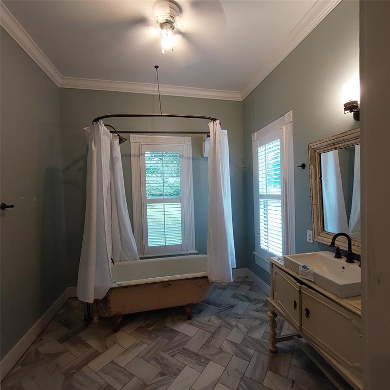 601 Holbrook Street Mount Vernon, TX 75457 - Photo 25 of 35 a bathroom with a sink and a mirror