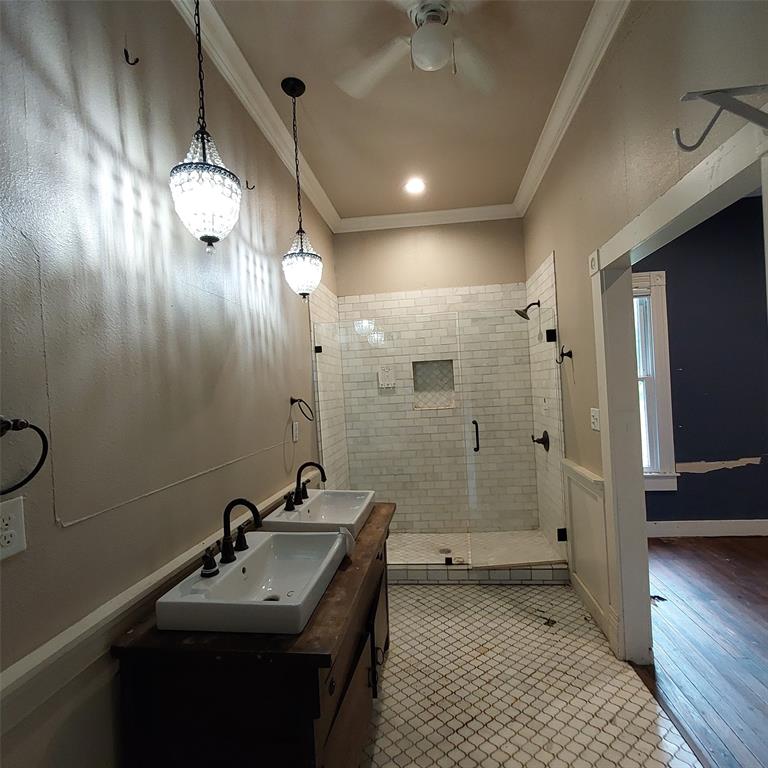 601 Holbrook Street Mount Vernon, TX 75457 - Photo 32 of 35 a bathroom with double vanity sink and a mirror